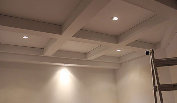 There is a ladder in the corner of the room.