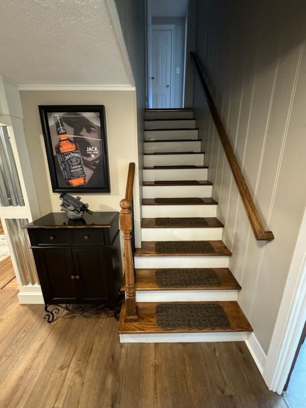 A set of stairs leading up to the second floor of a house