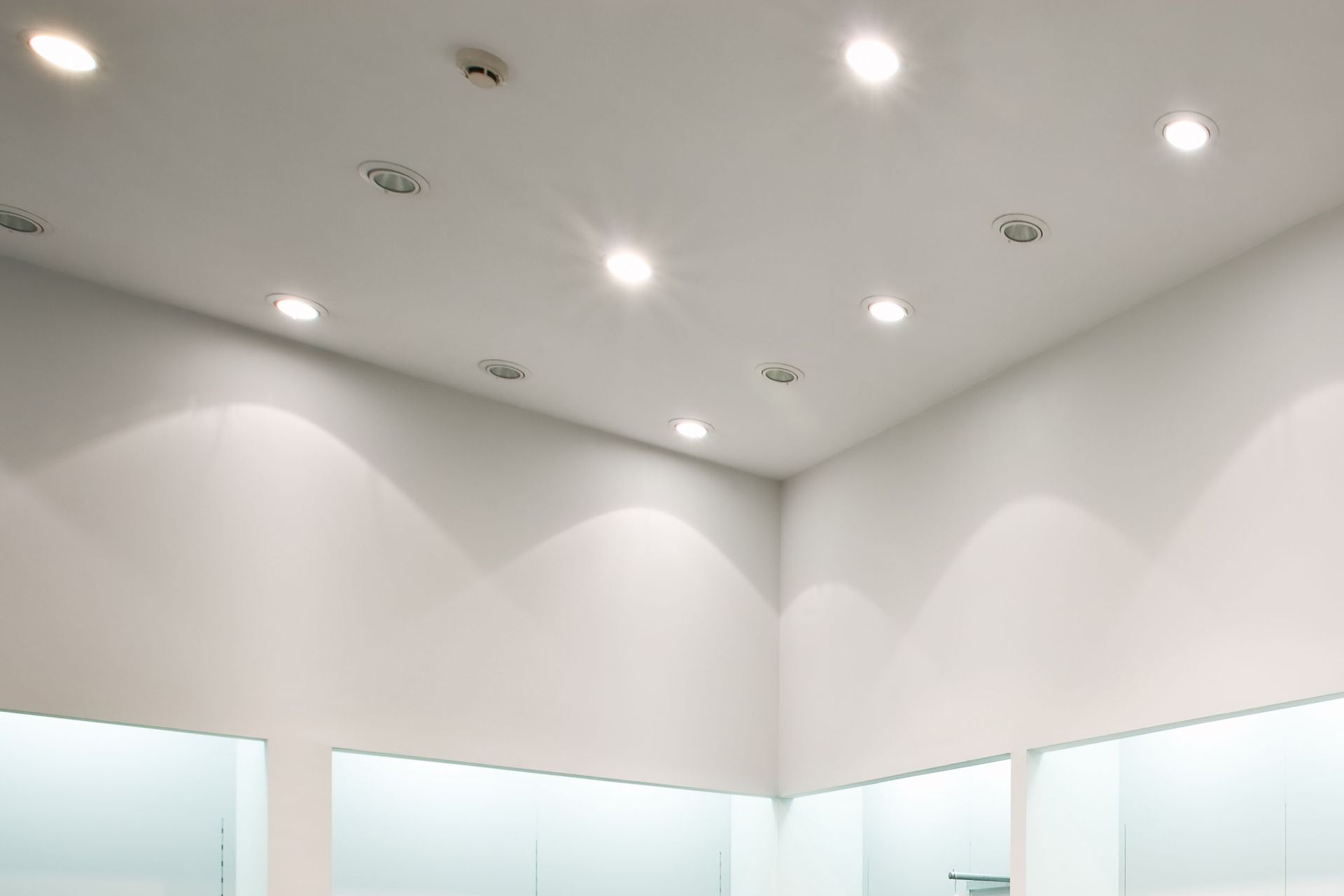 A room with a ceiling that has a lot of lights on it.