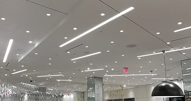 A large room with a lot of lights on the ceiling.
