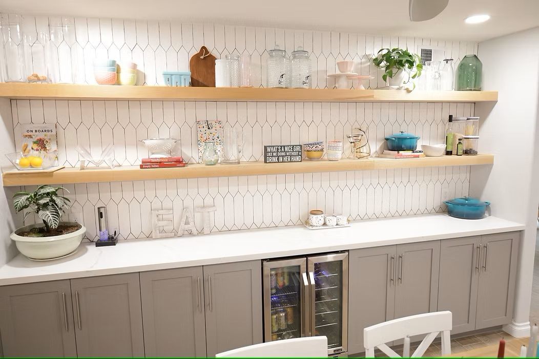 A bathroom with a sink , toilet and mirror.