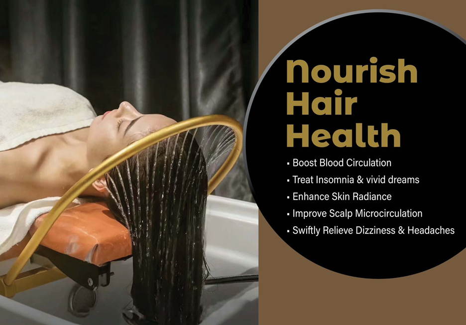 A woman is getting her hair washed in a sink.