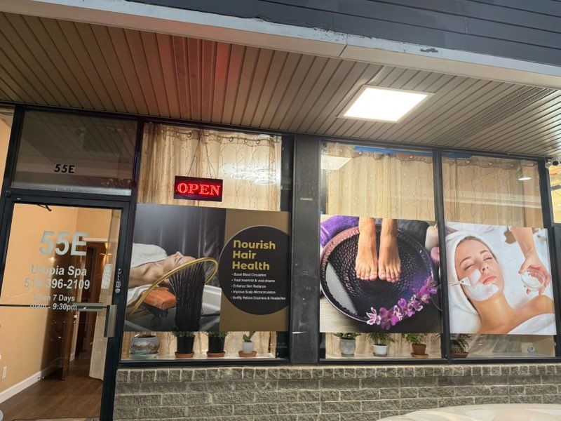 The front of a spa with a sign that says open.