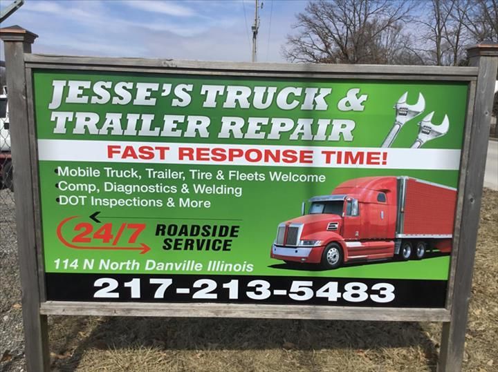 A sign for Jesse's Truck & Trailer Repair in Danville, Illinois, advertising 24/7 roadside service and contact 217-213-5483.