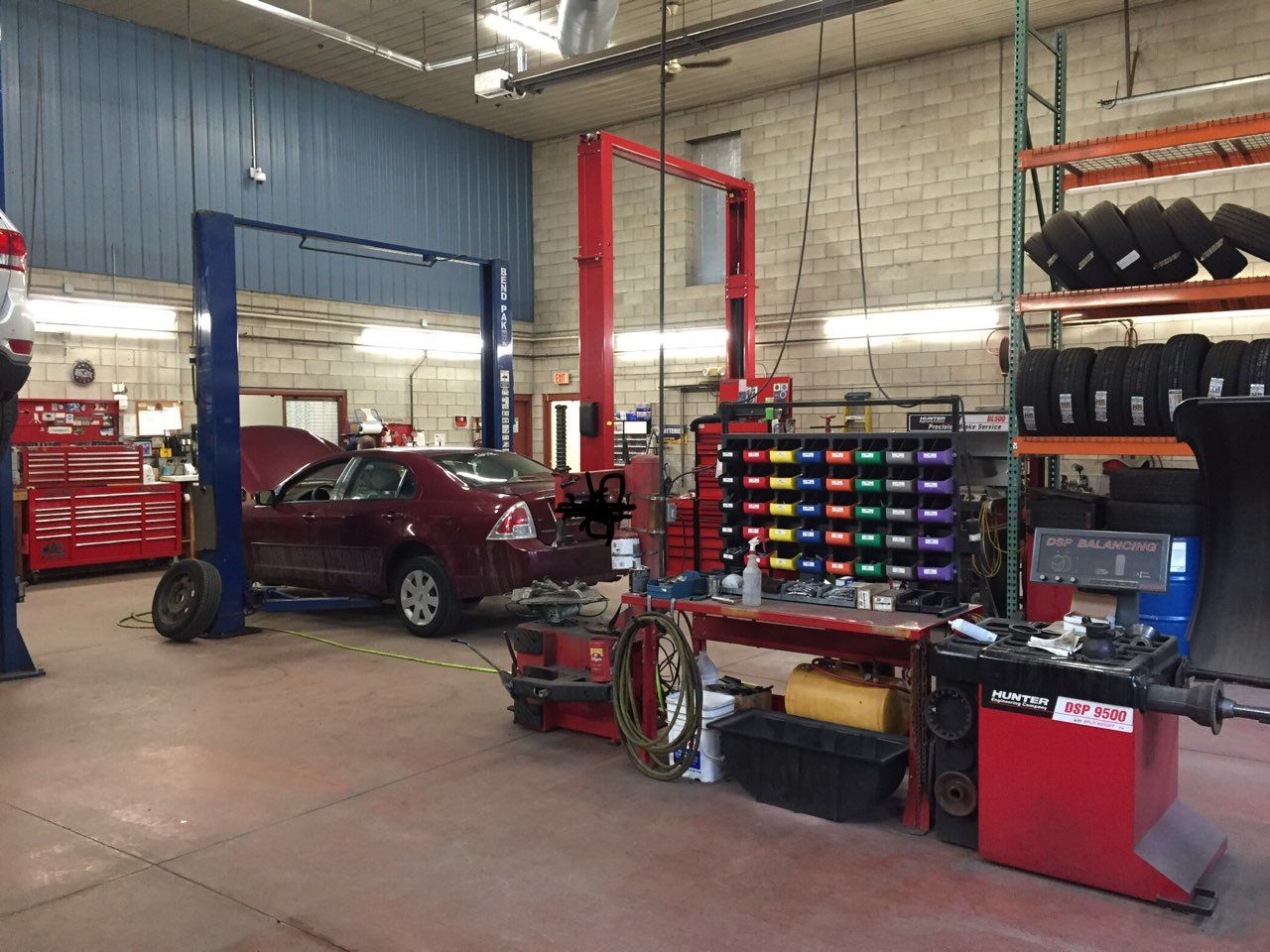 Cars inside an auto repair shop