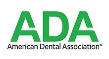 Logo of the American Dental Association in green text.