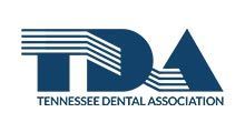 Logo of the Tennessee Dental Association in navy blue and white. Text reads 