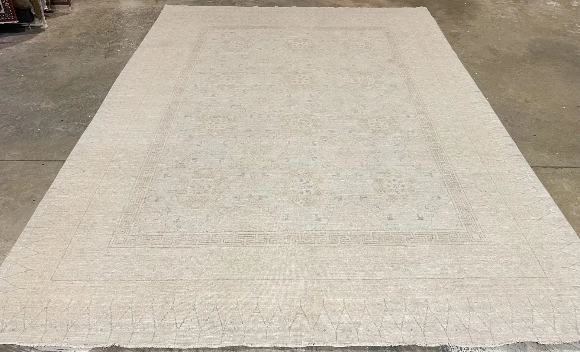 A rug with a detailed pattern on it.