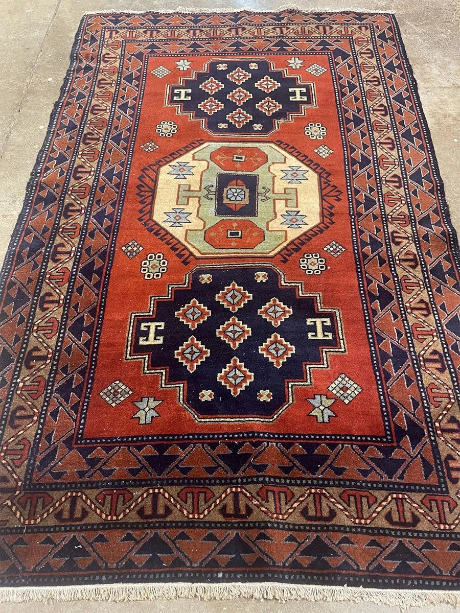 A rug with a detailed pattern on it.