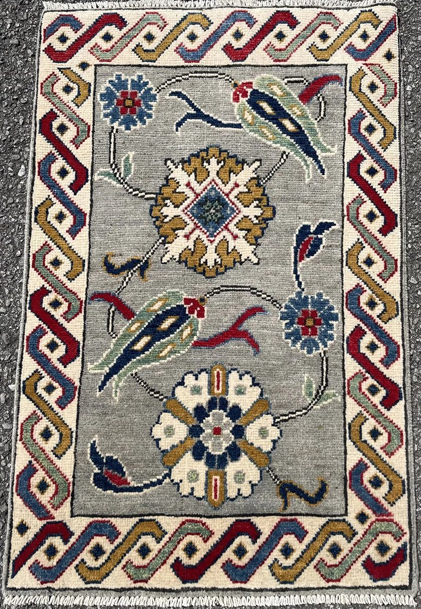 A rug with a detailed pattern on it.