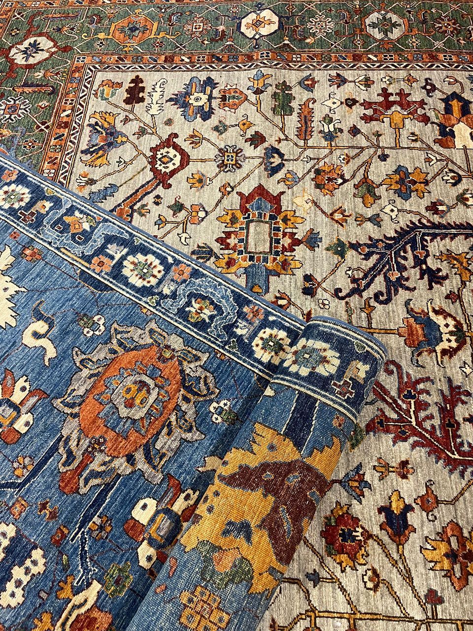 A close up of a rug with a floral pattern on it