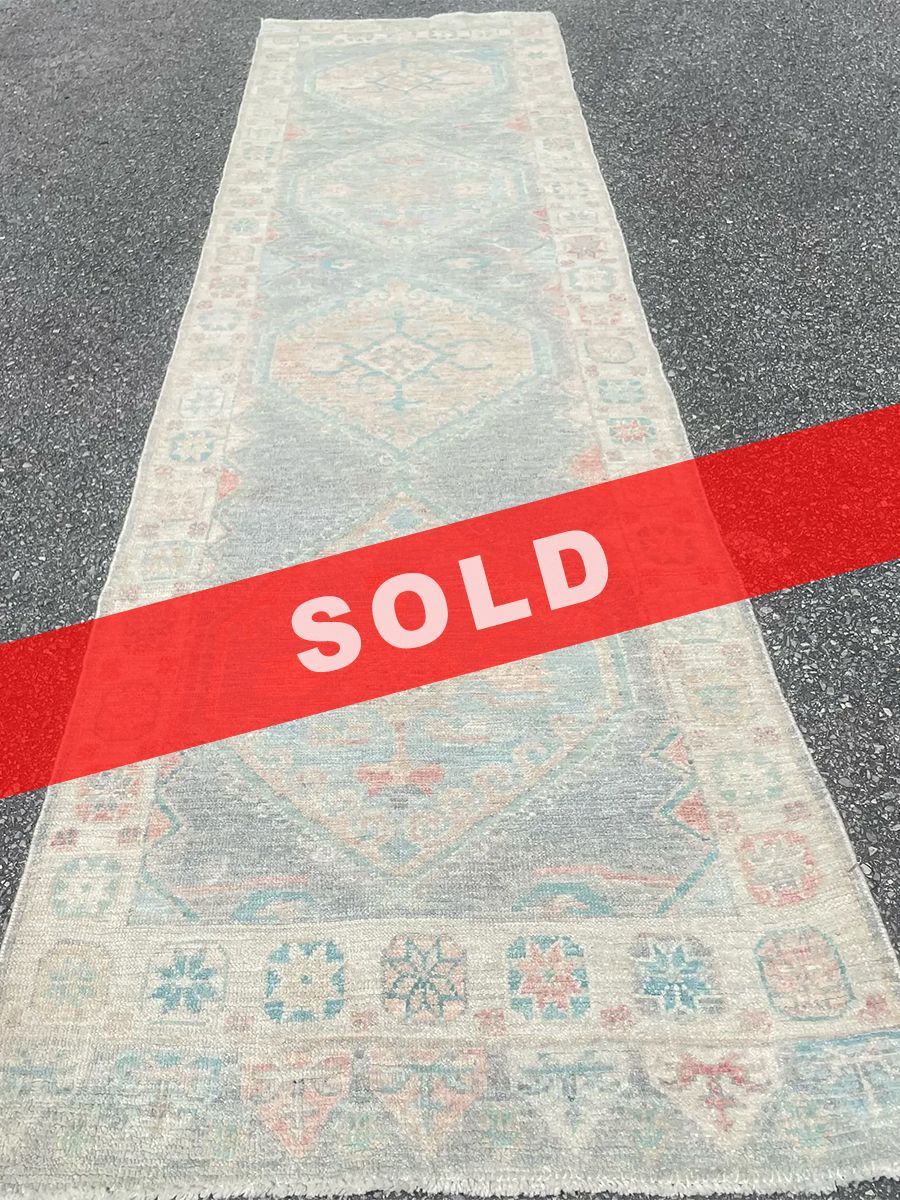 A rug with a detailed pattern on it.