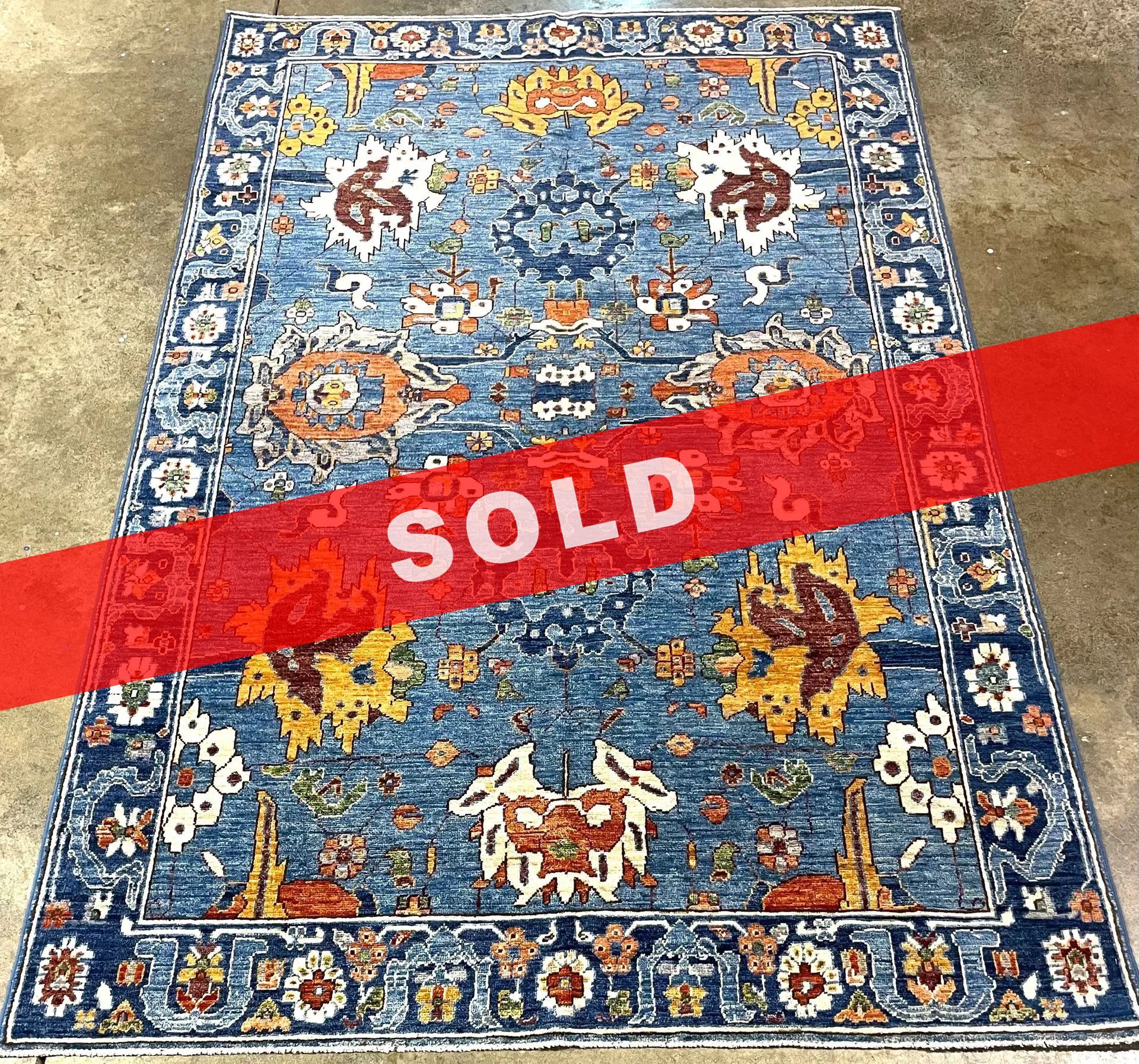 A rug with a detailed pattern on it.