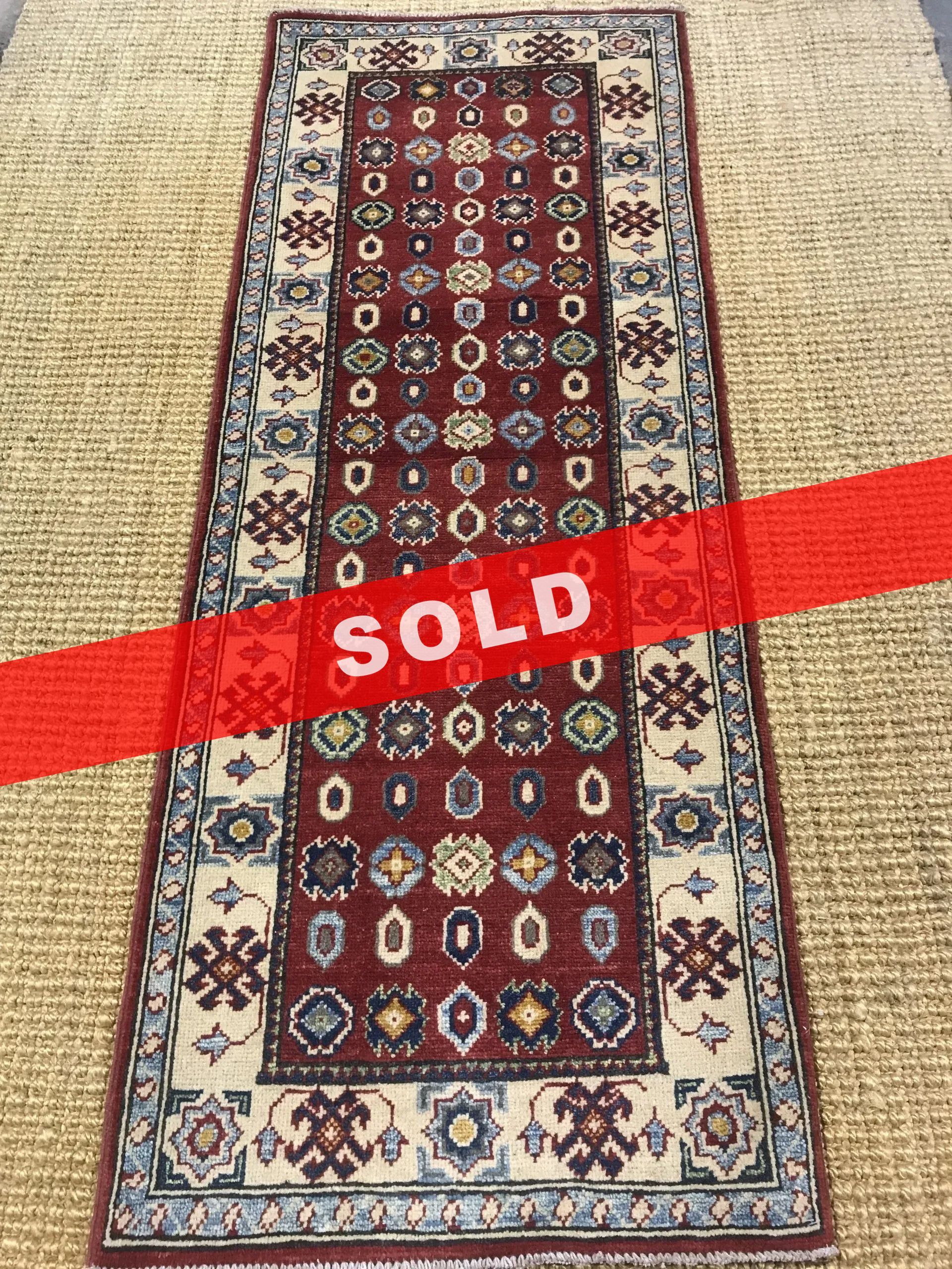 A rug with a detailed pattern on it.