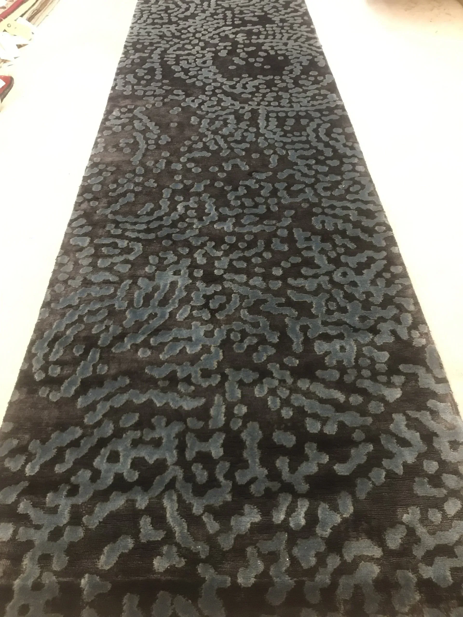 A rug with a detailed pattern on it.