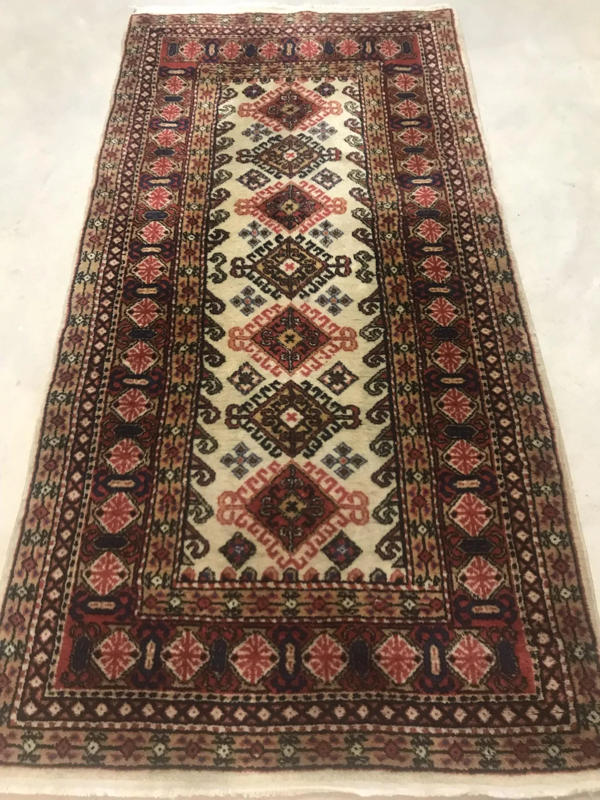 A rug with a detailed pattern on it.