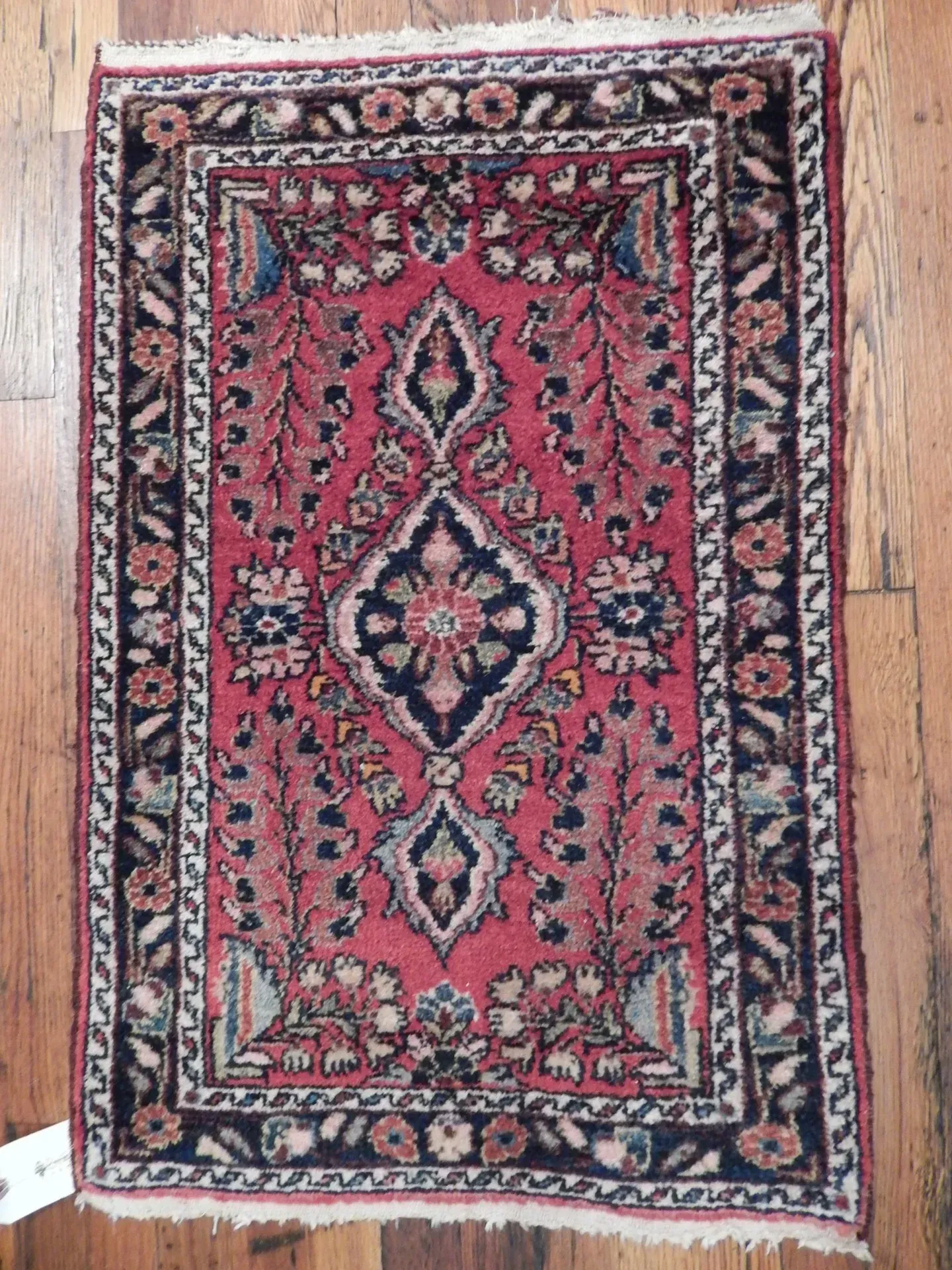 A rug with a detailed pattern on it.