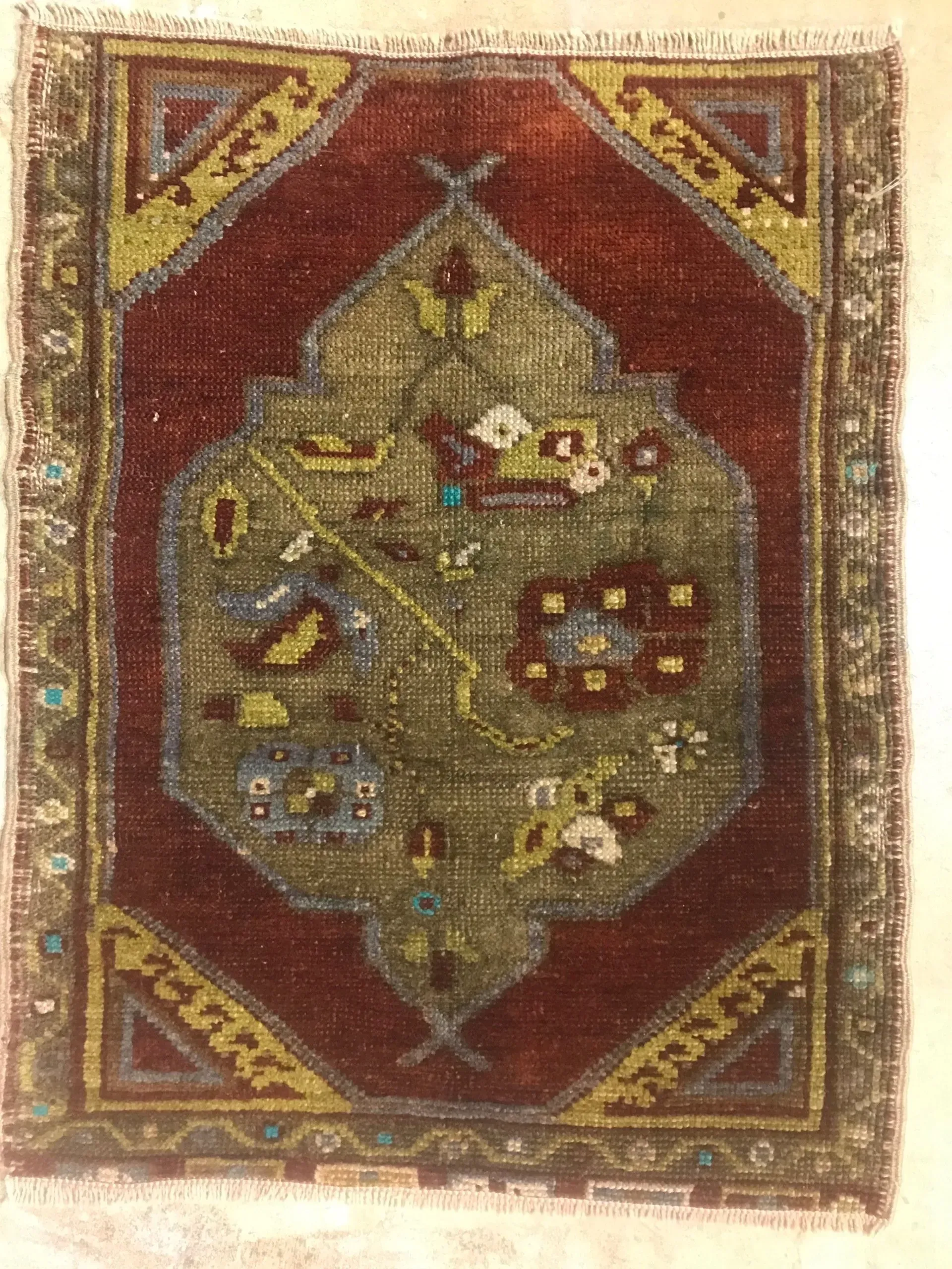 A rug with a detailed pattern on it.