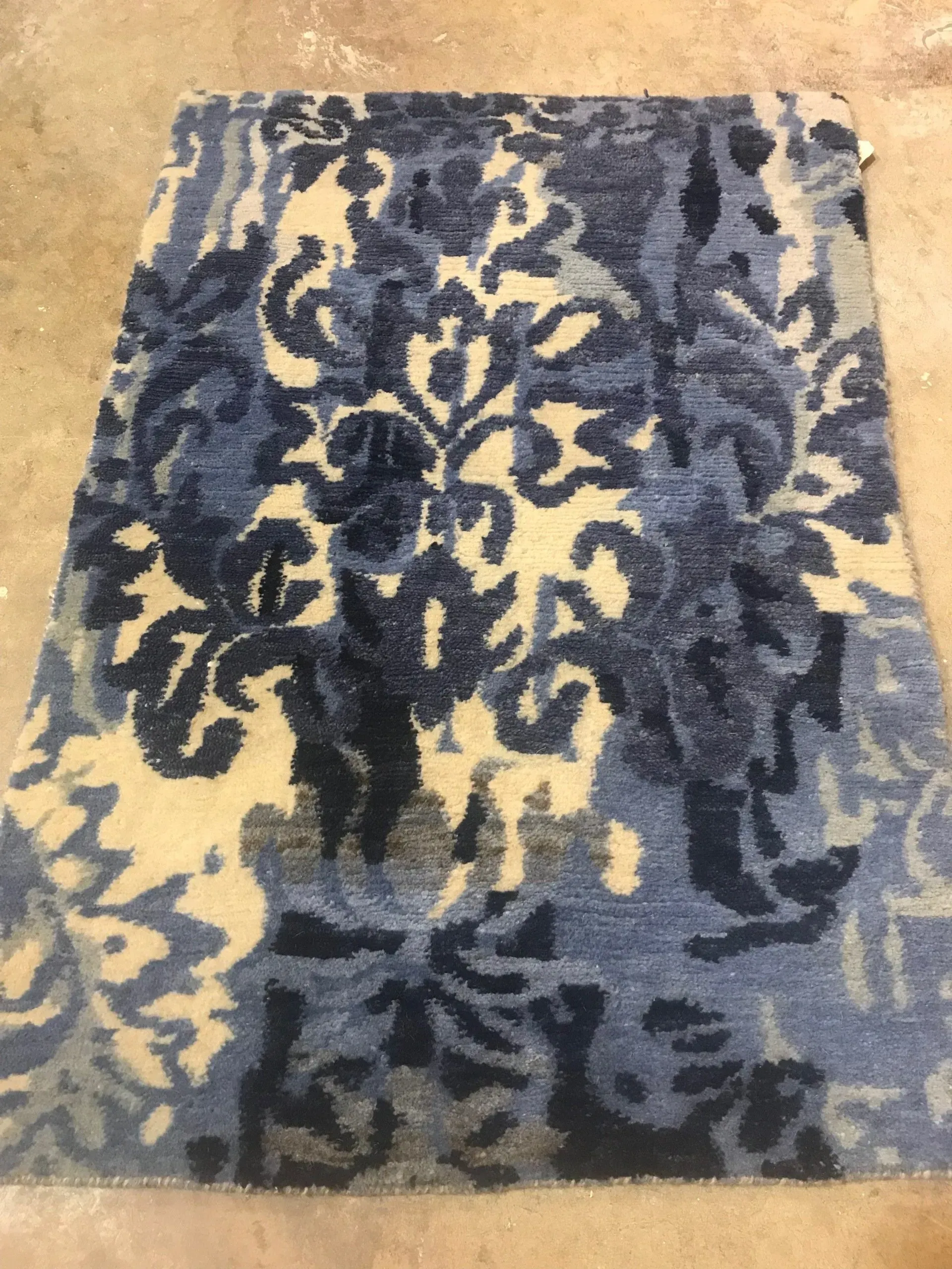 A rug with a detailed pattern on it.