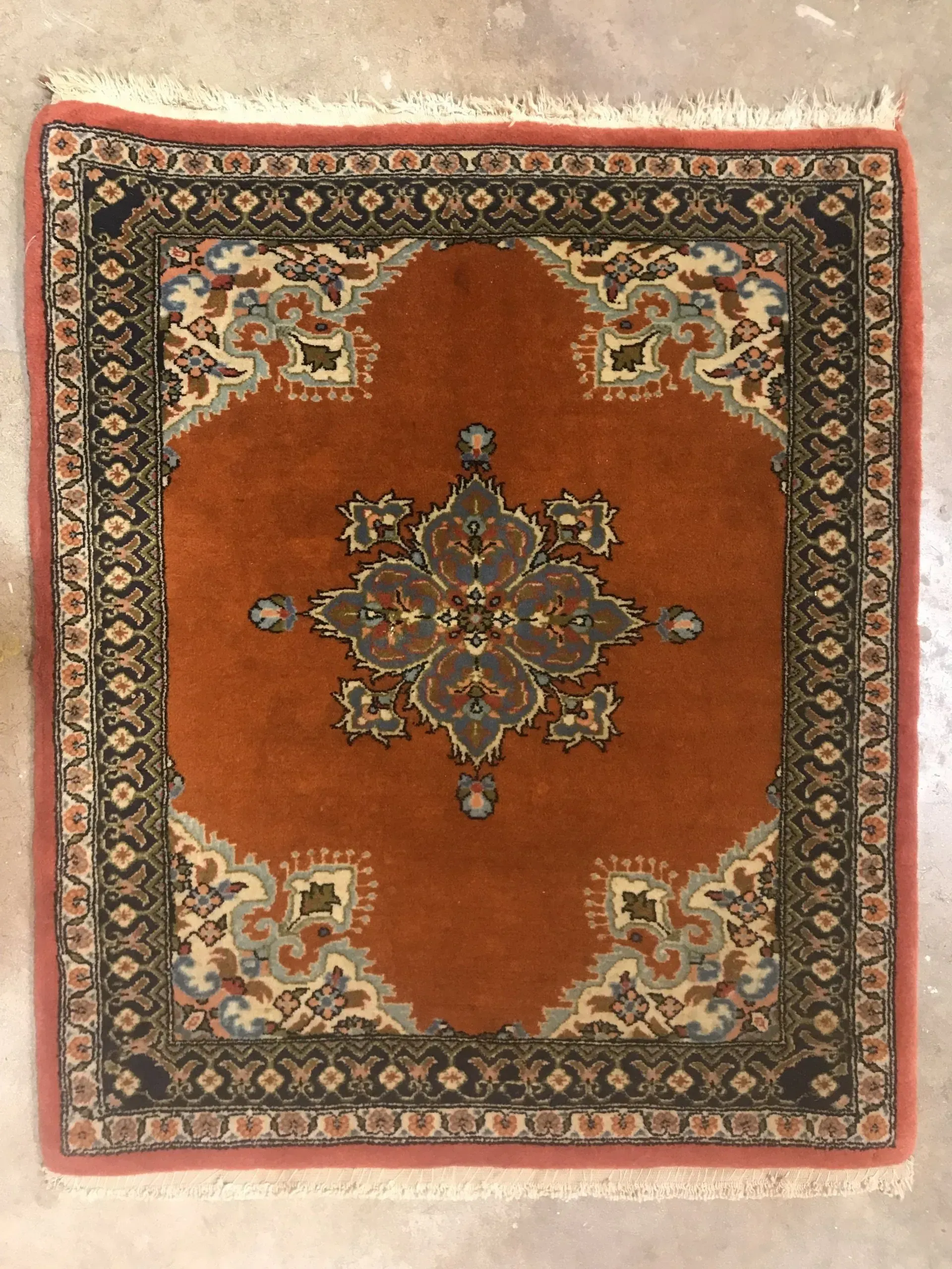 A rug with a detailed pattern on it.