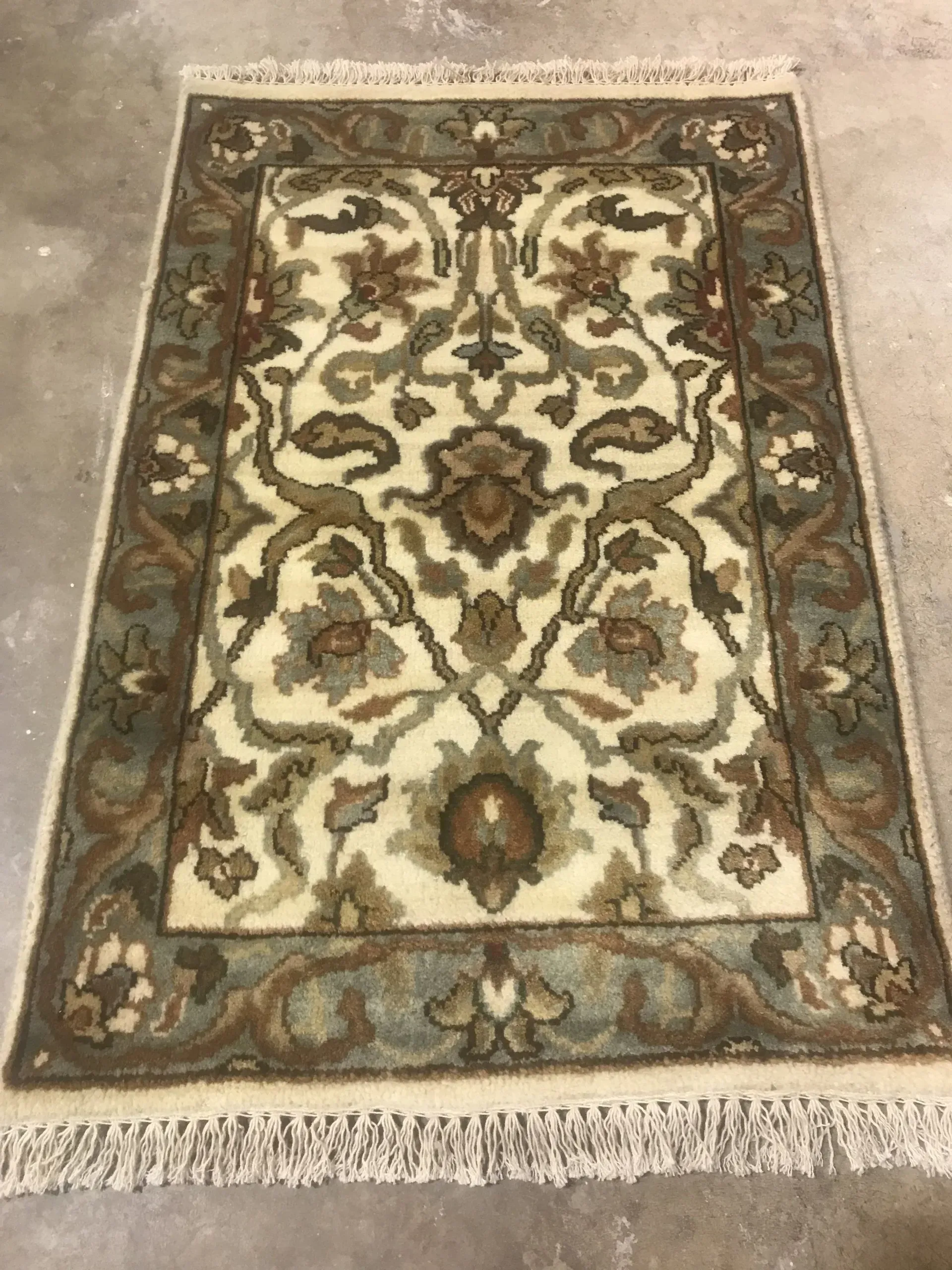 A rug with a detailed pattern on it.