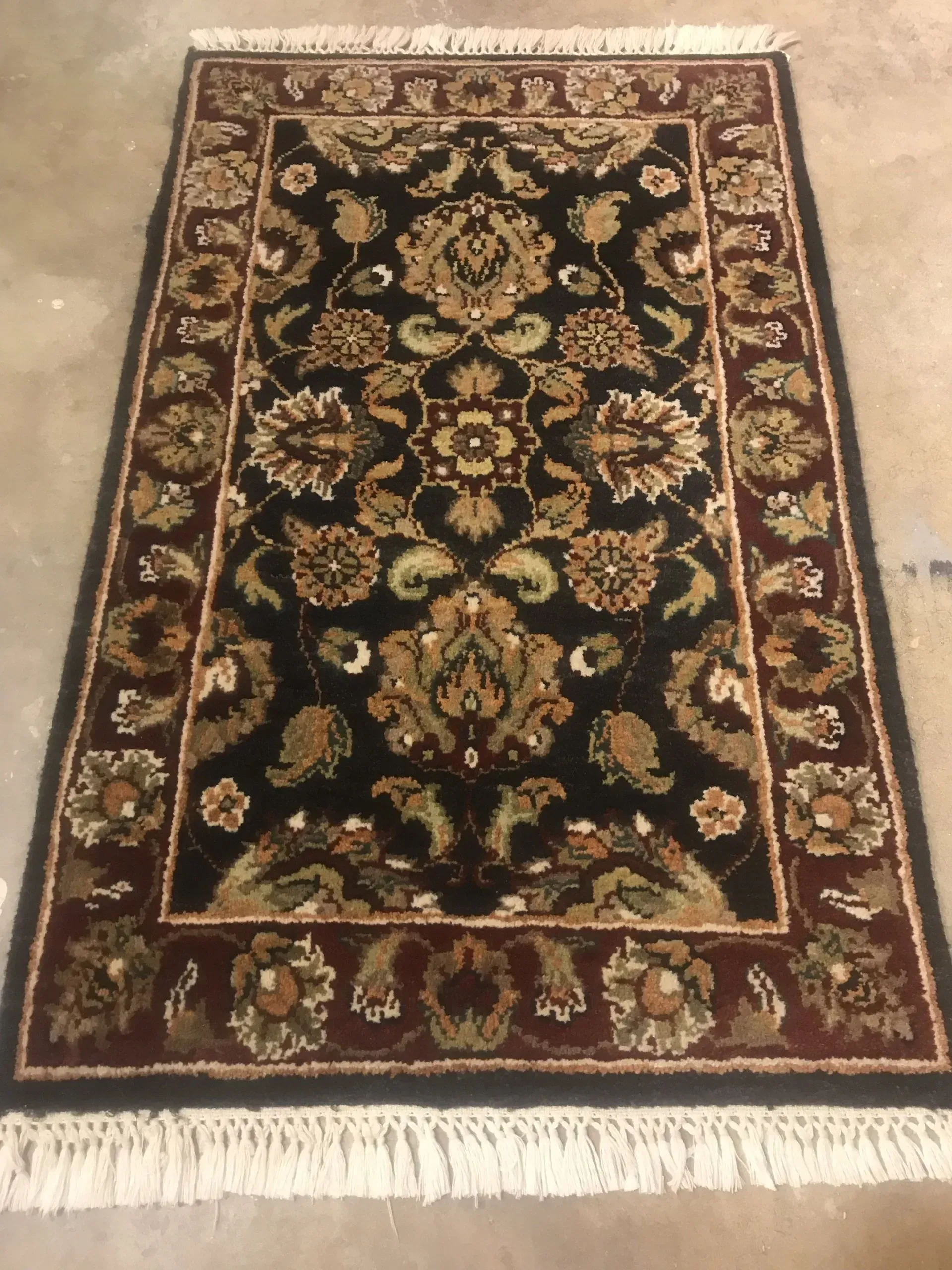 A rug with a detailed pattern on it.