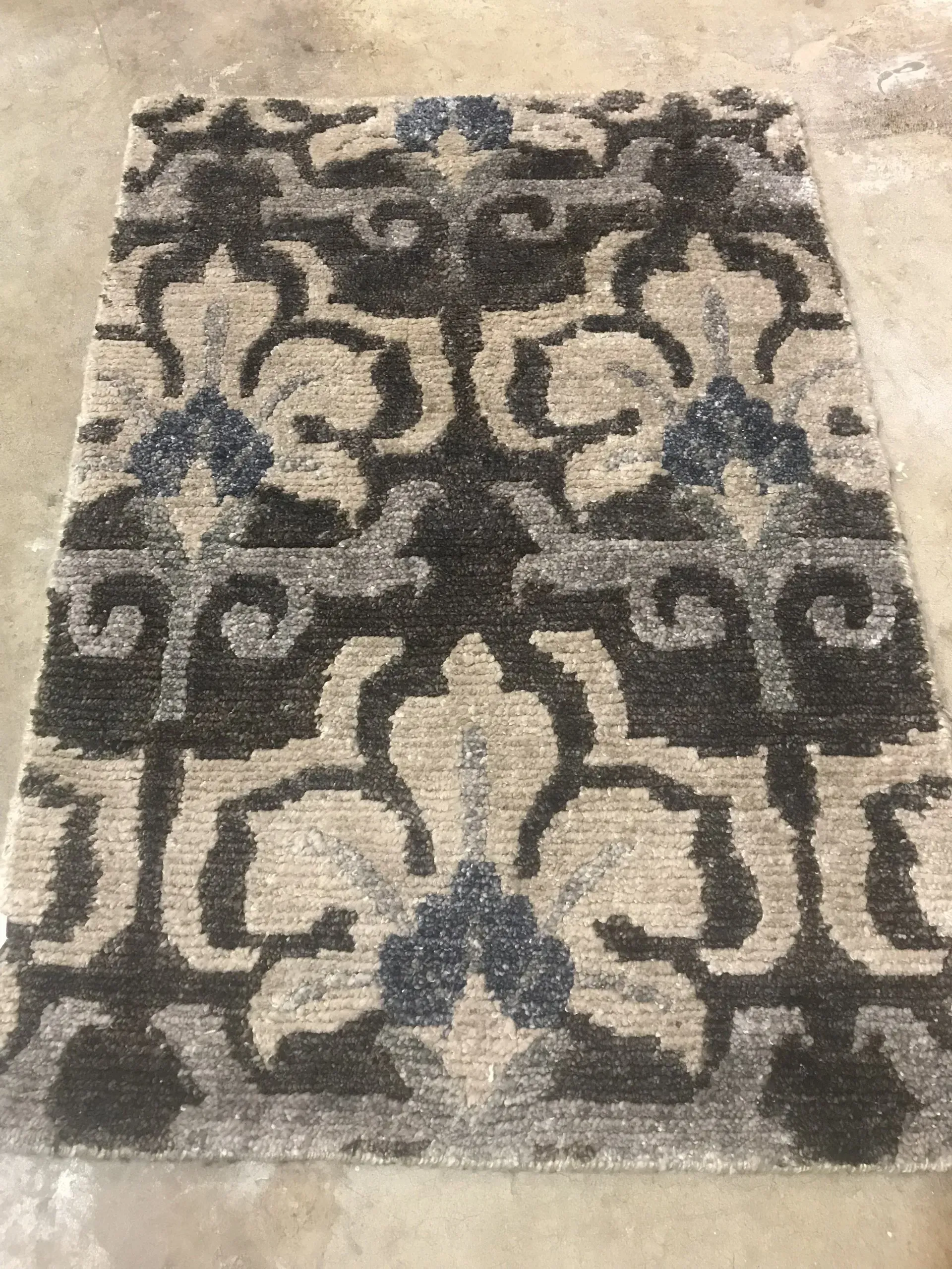 A rug with a detailed pattern on it.