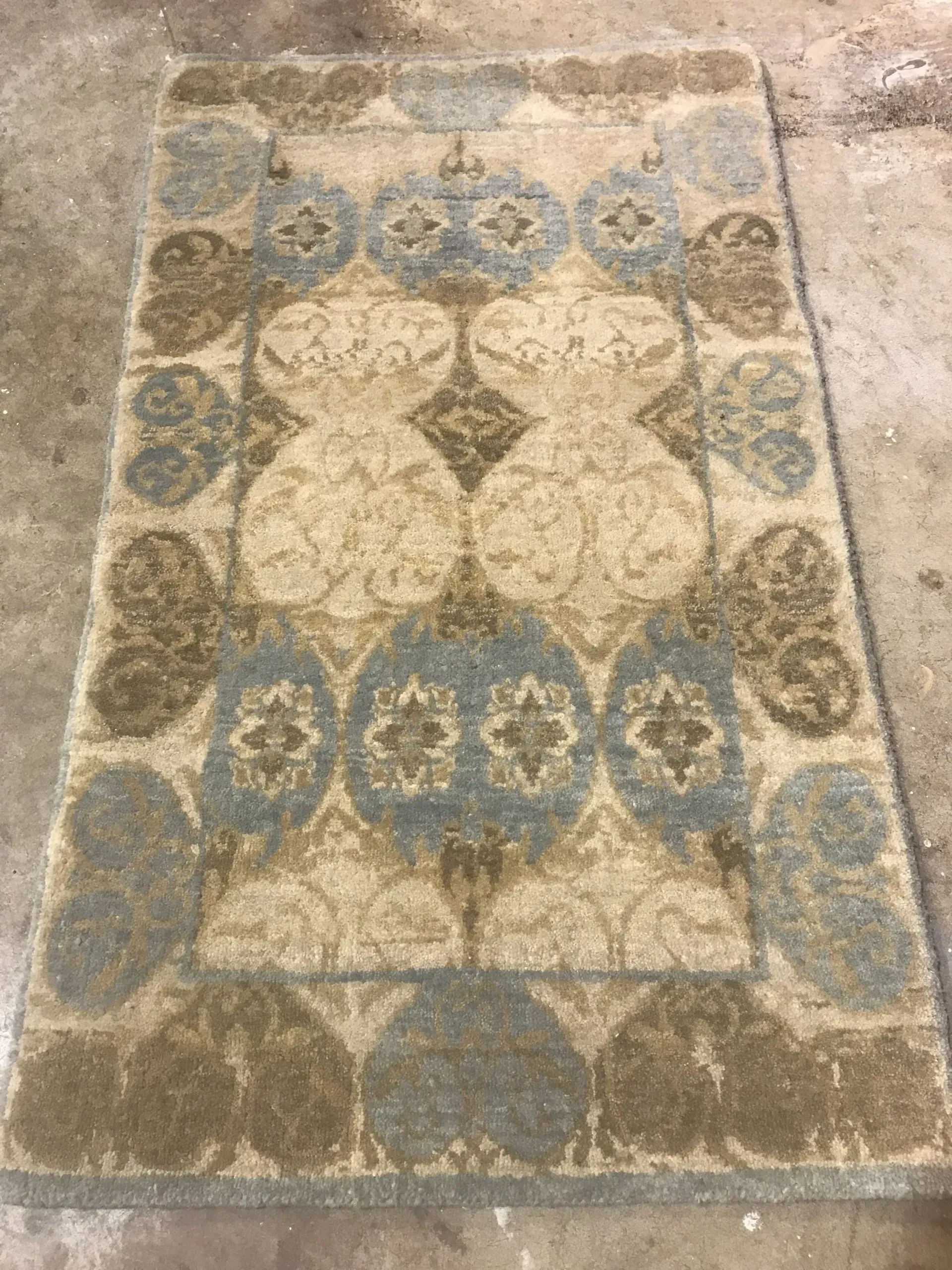 A rug with a detailed pattern on it.