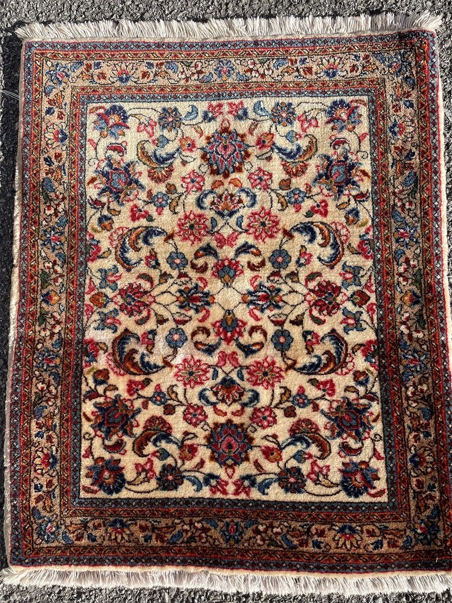 A rug with a detailed pattern on it.