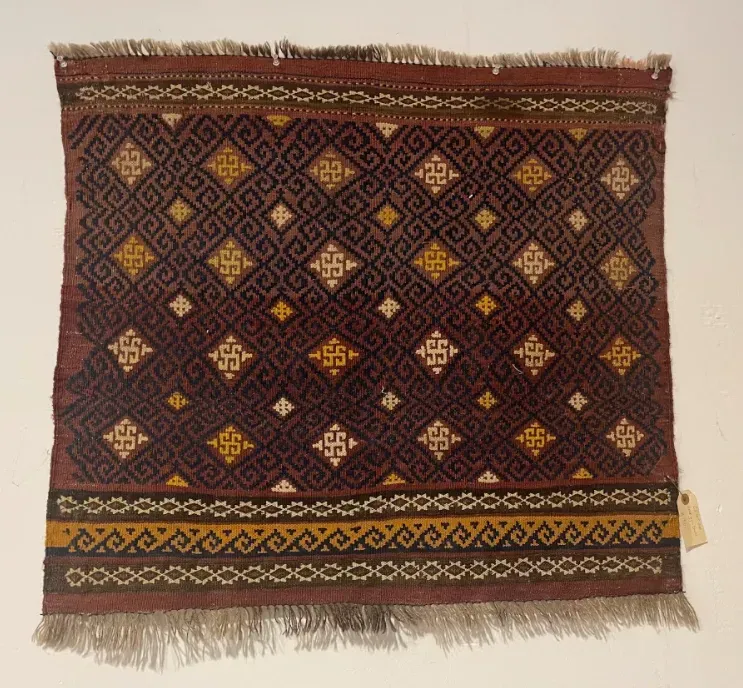 A rug with a detailed pattern on it.