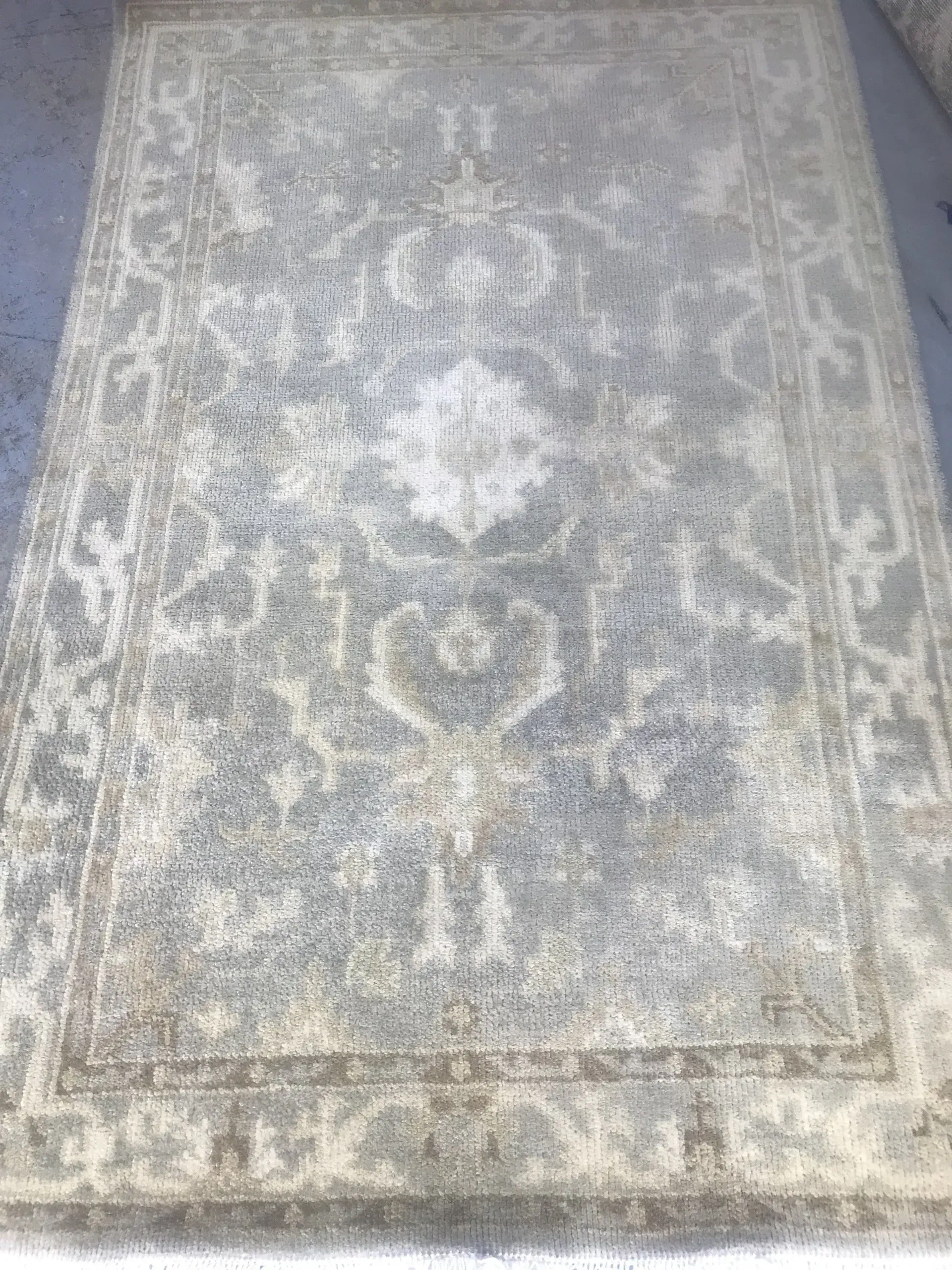 A rug with a detailed pattern on it.