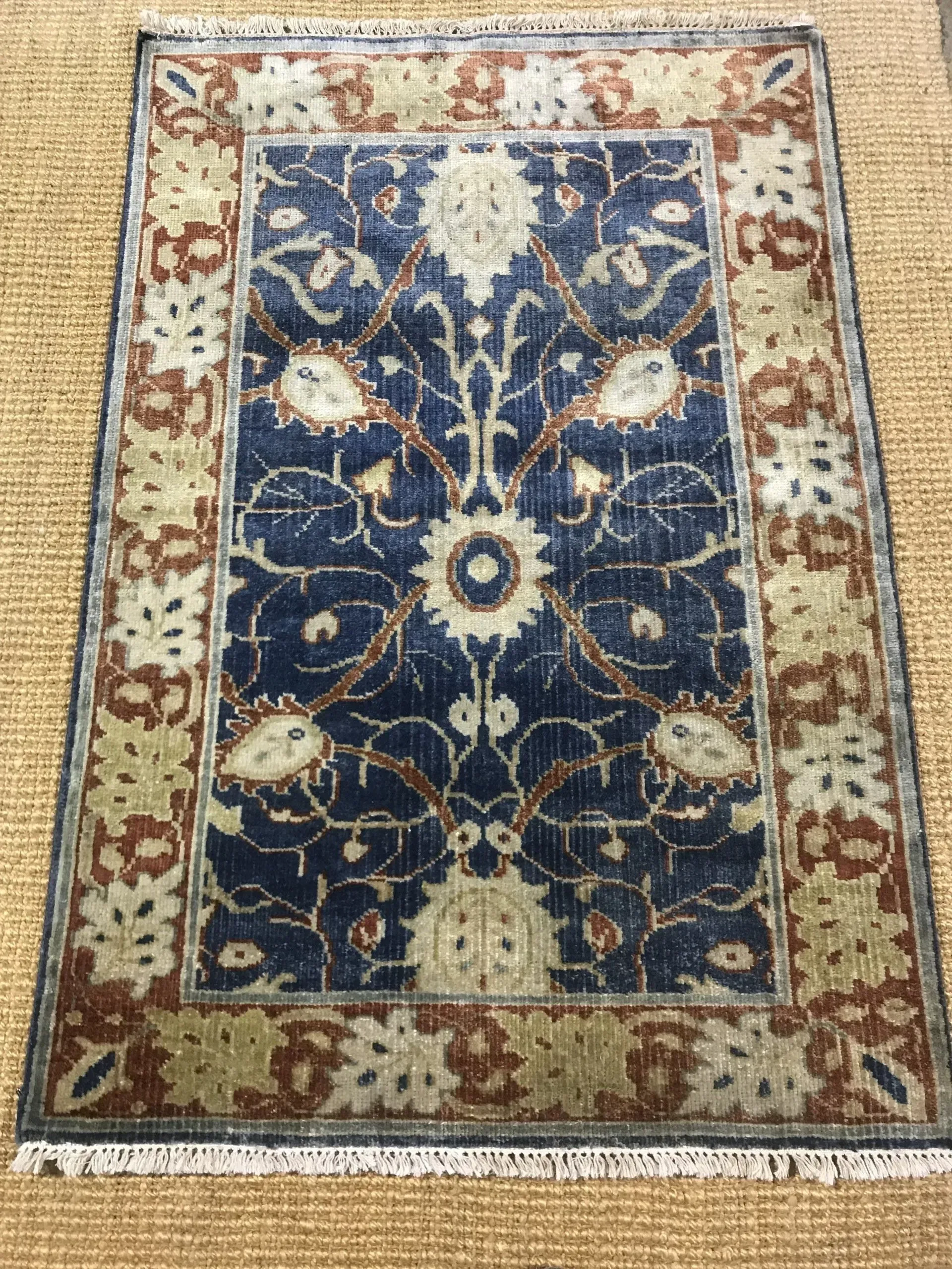 A rug with a detailed pattern on it.
