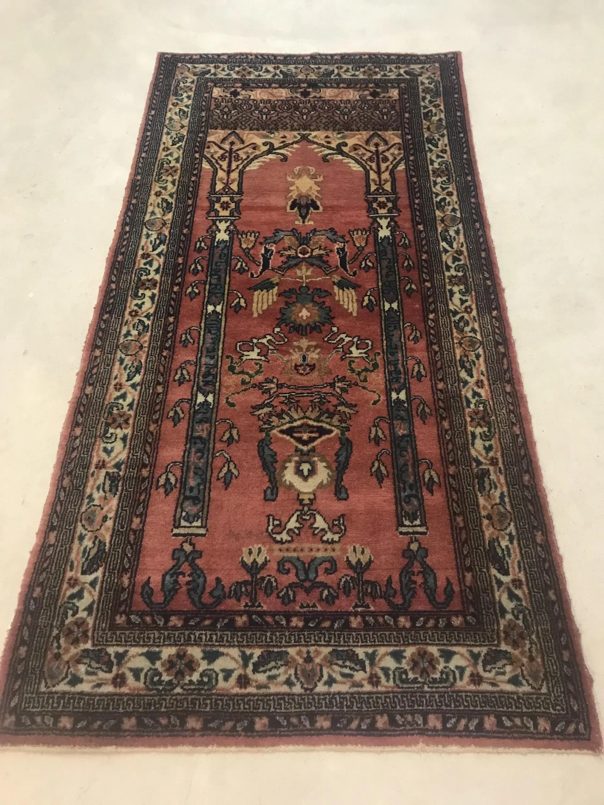 A rug with a detailed pattern on it.