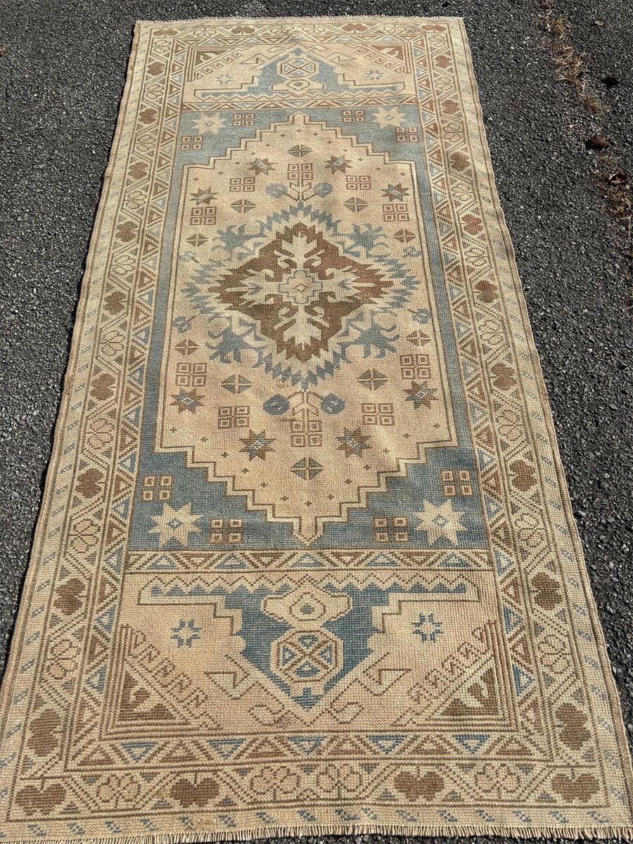 A rug with a detailed pattern on it.