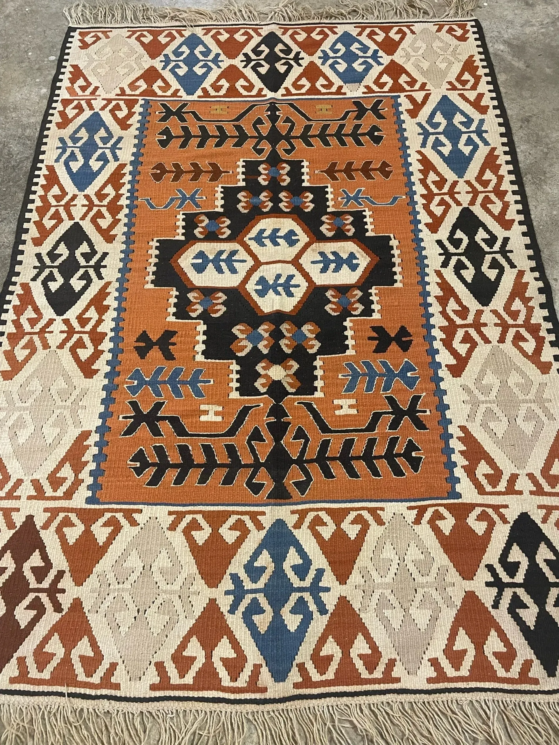 A rug with a detailed pattern on it.