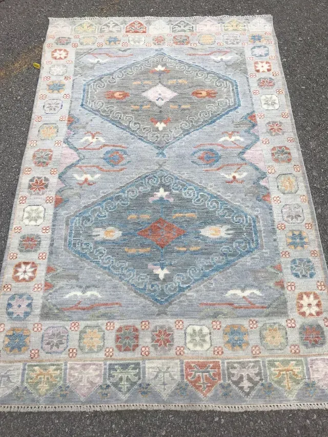 A rug with a detailed pattern on it.