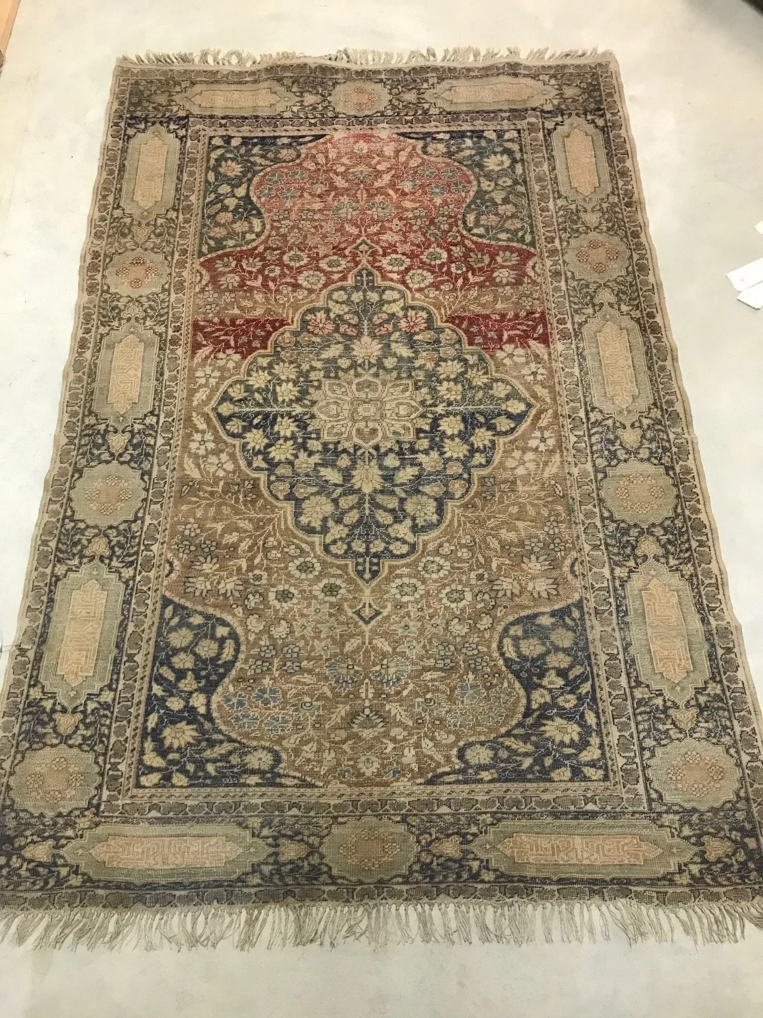 A rug with a detailed pattern on it.