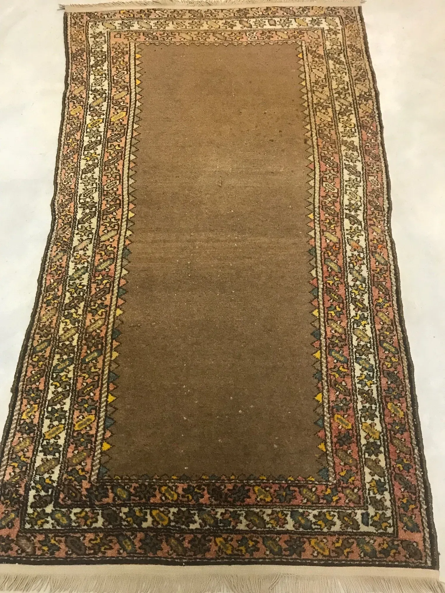 A rug with a detailed pattern on it.