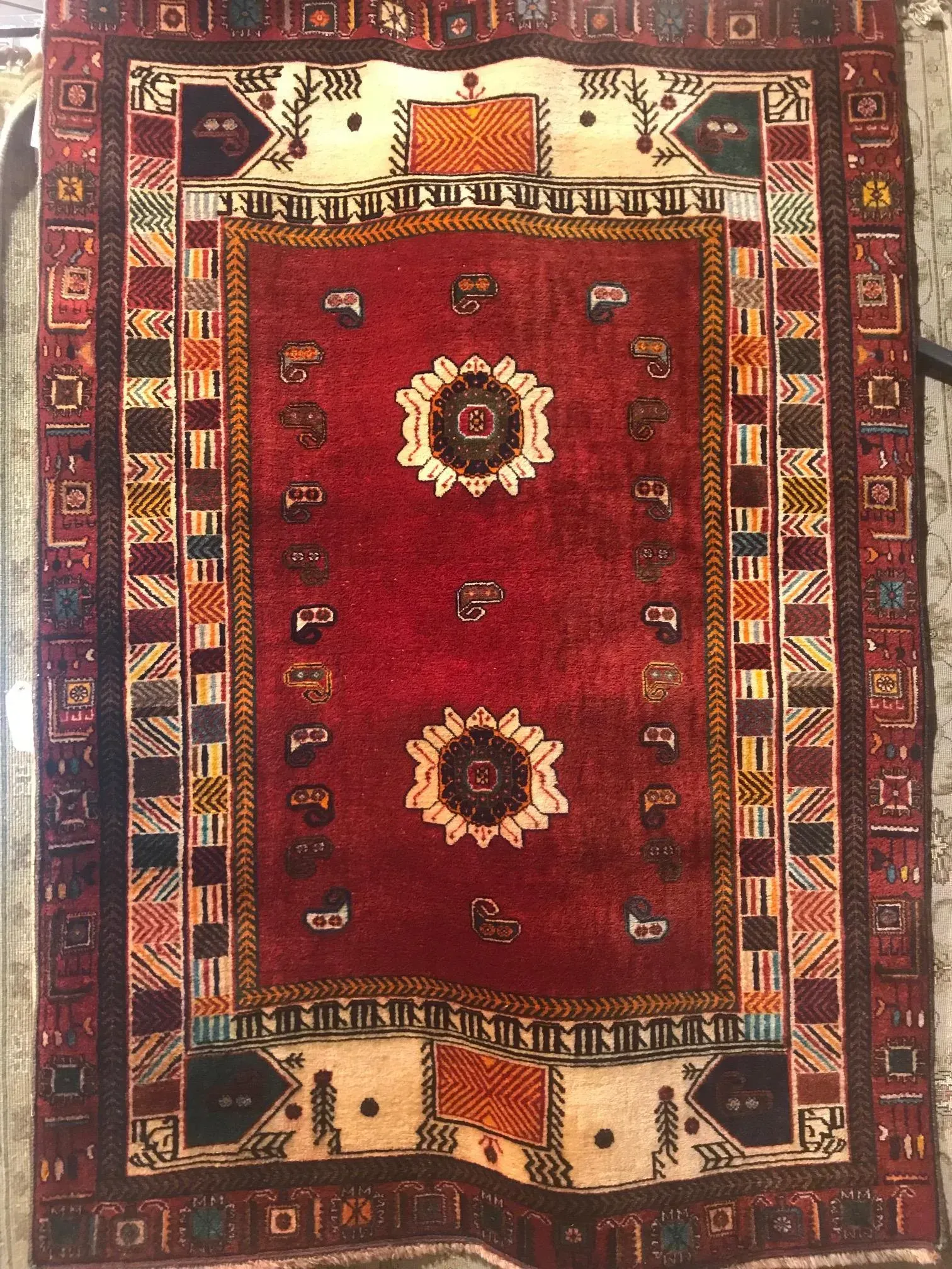 A rug with a detailed pattern on it.