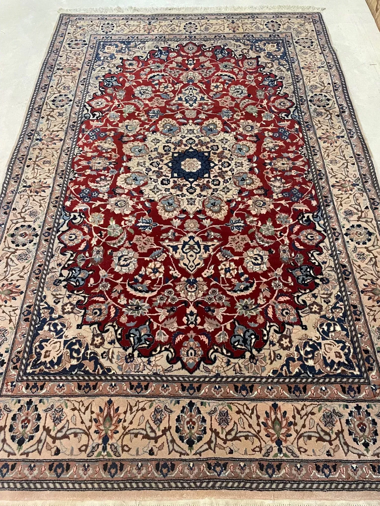 A rug with a detailed pattern on it.