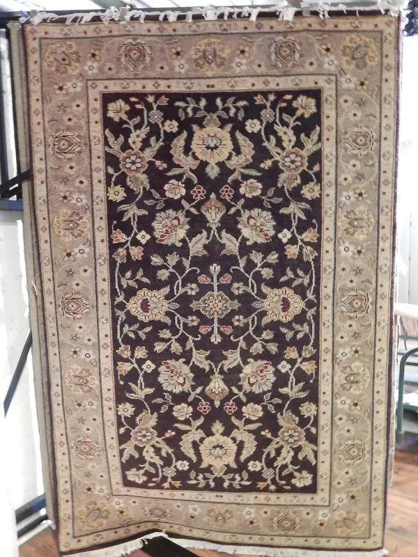 A rug with a detailed pattern on it.