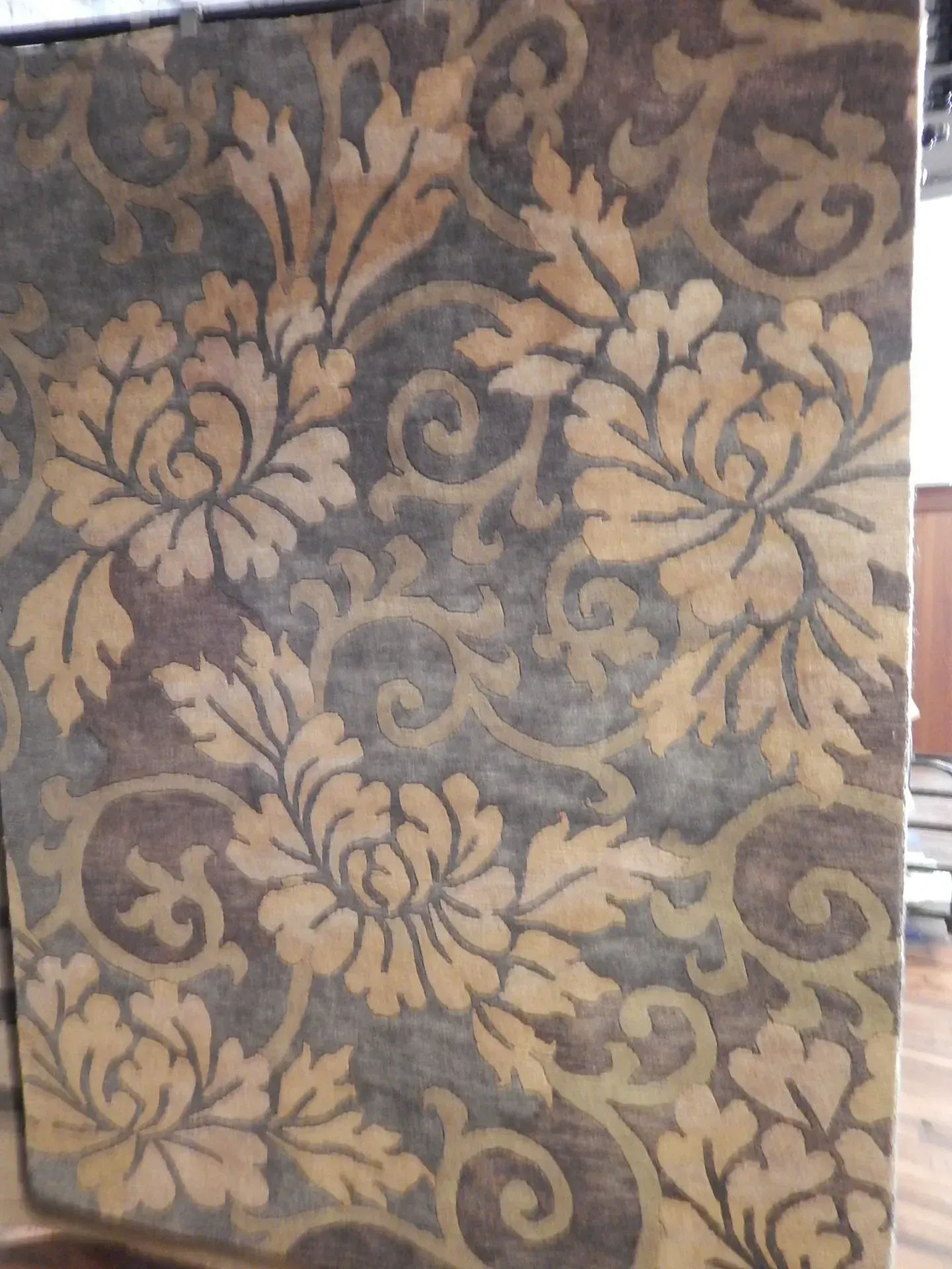 A rug with a detailed pattern on it.