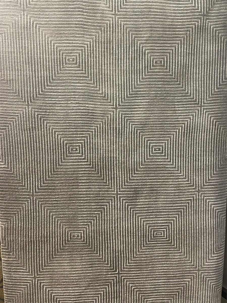 A rug with a detailed pattern on it.