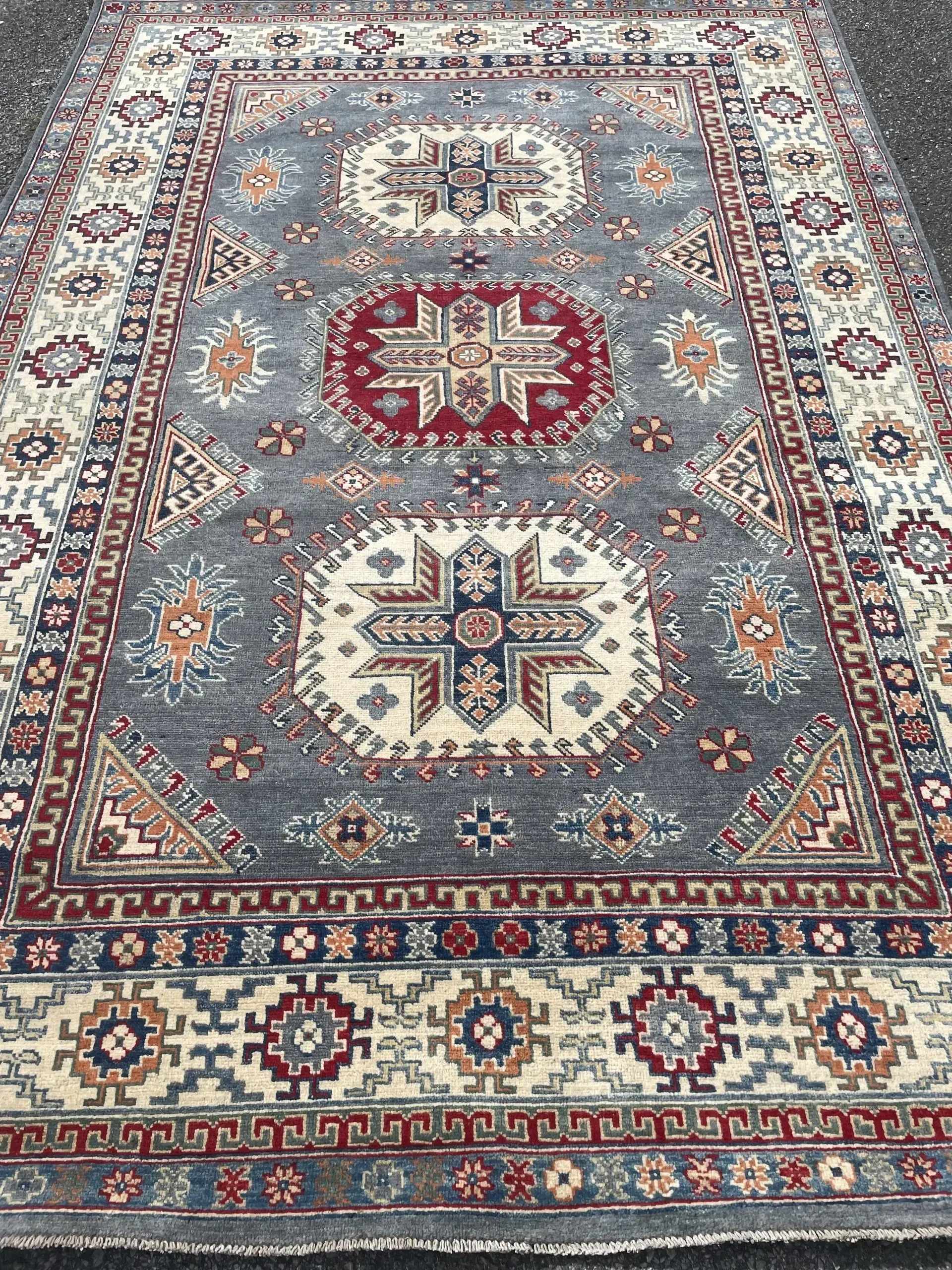 A rug with a detailed pattern on it.
