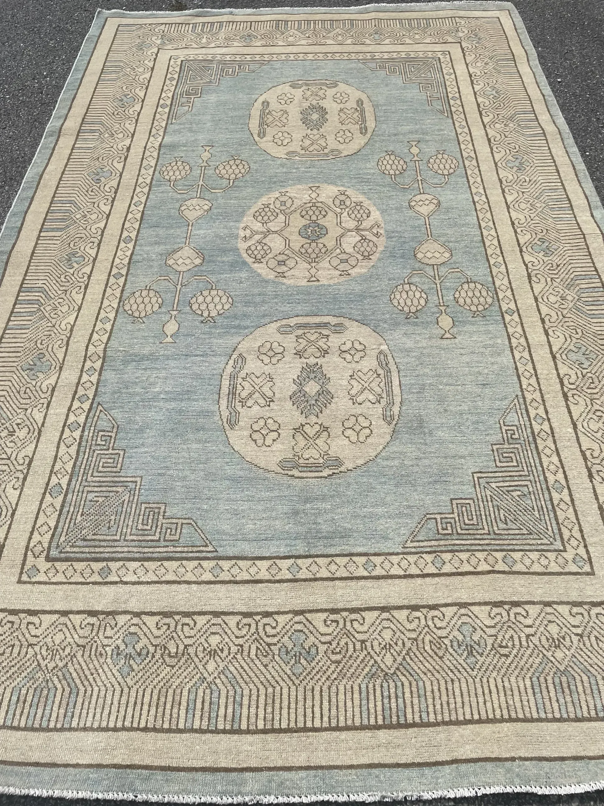 A rug with a detailed pattern on it.