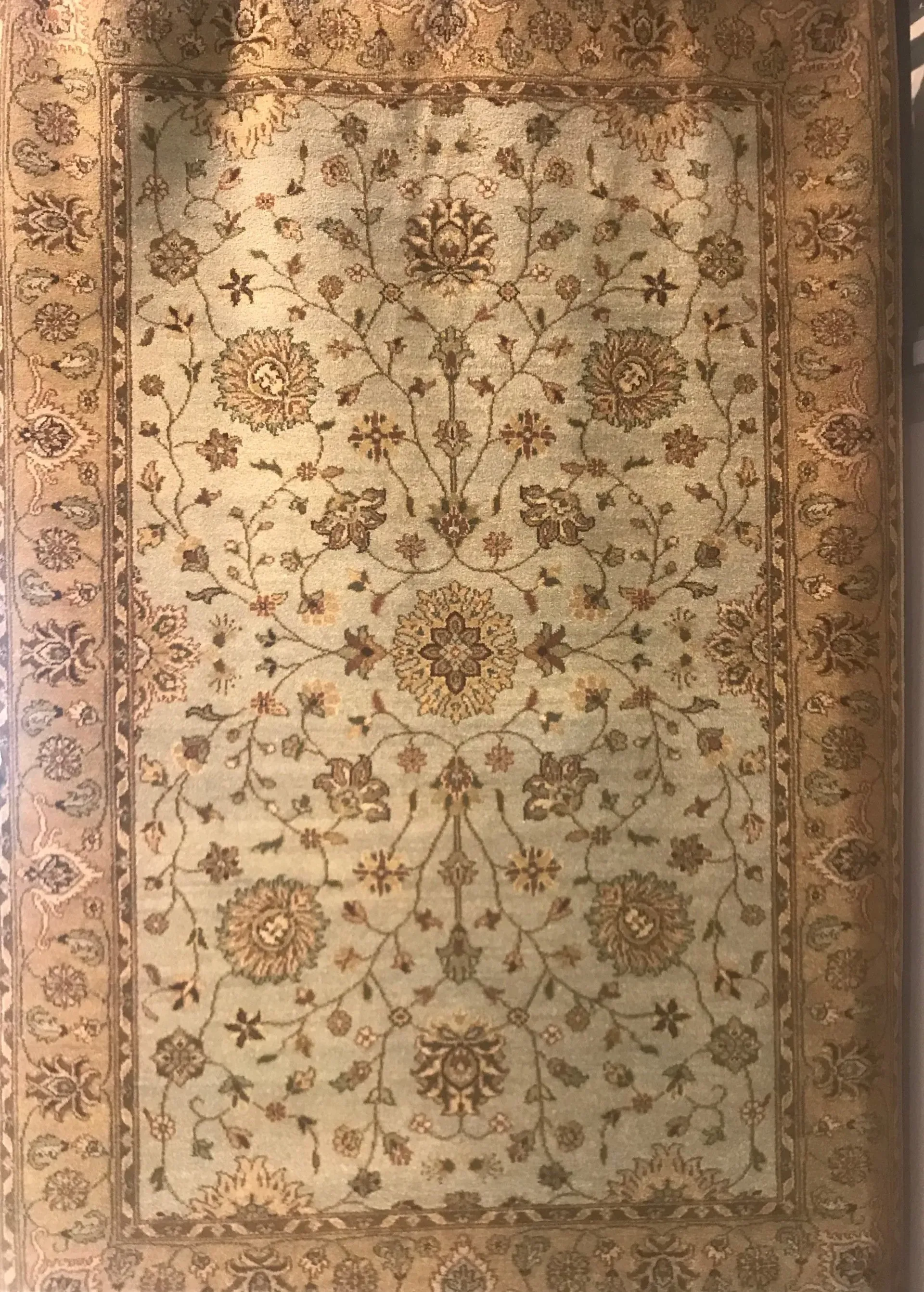 A rug with a detailed pattern on it.
