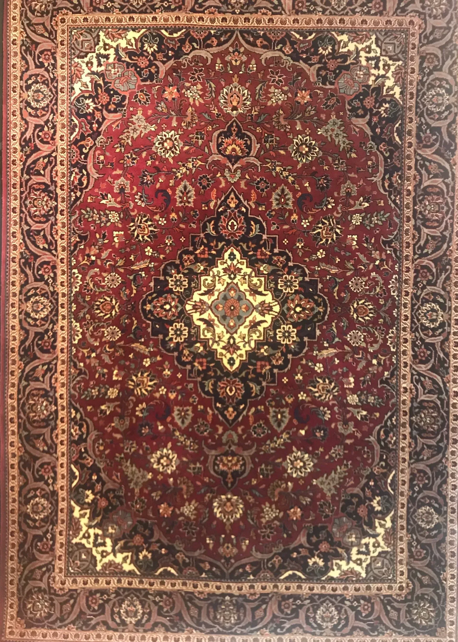 A rug with a detailed pattern on it.