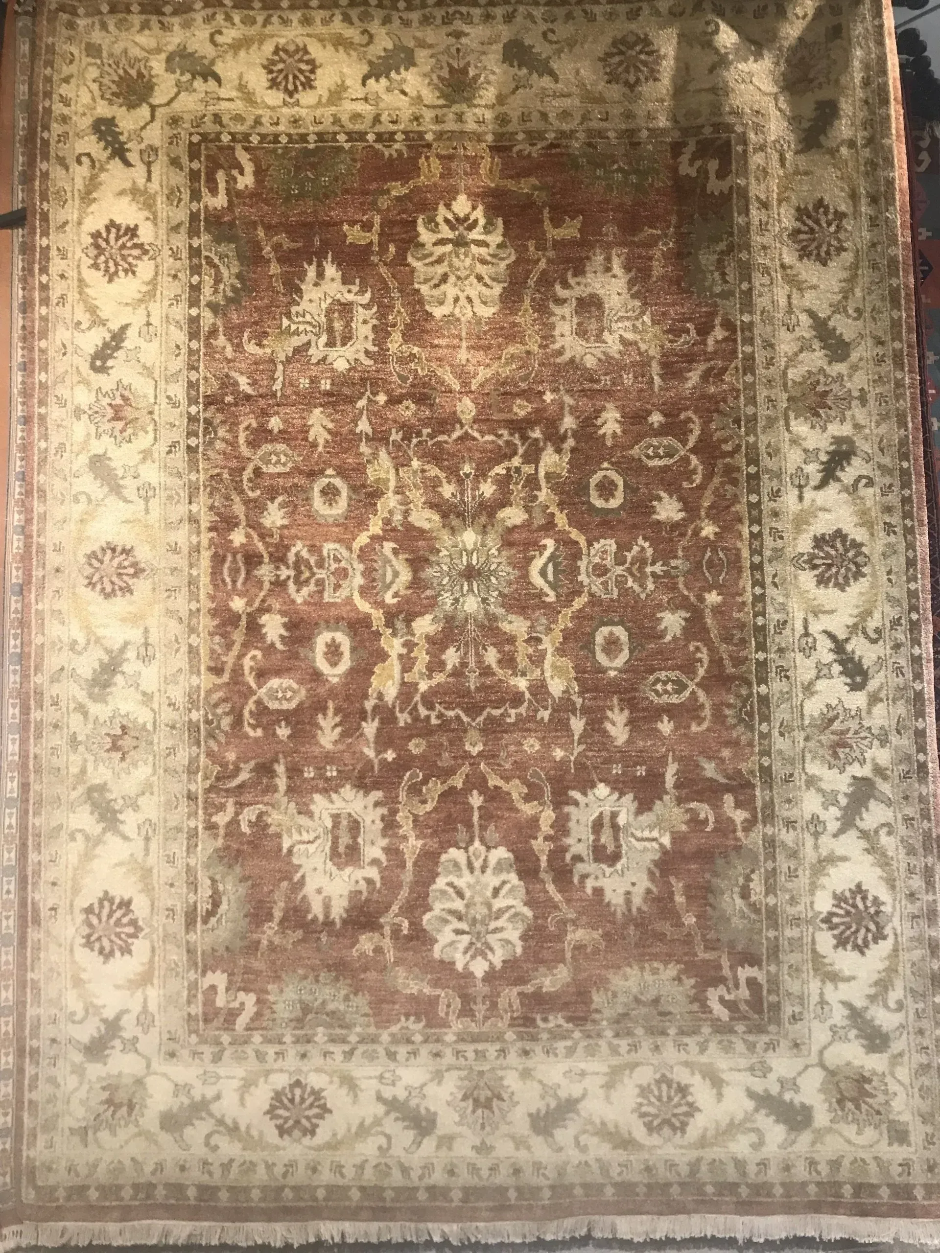 A rug with a detailed pattern on it.