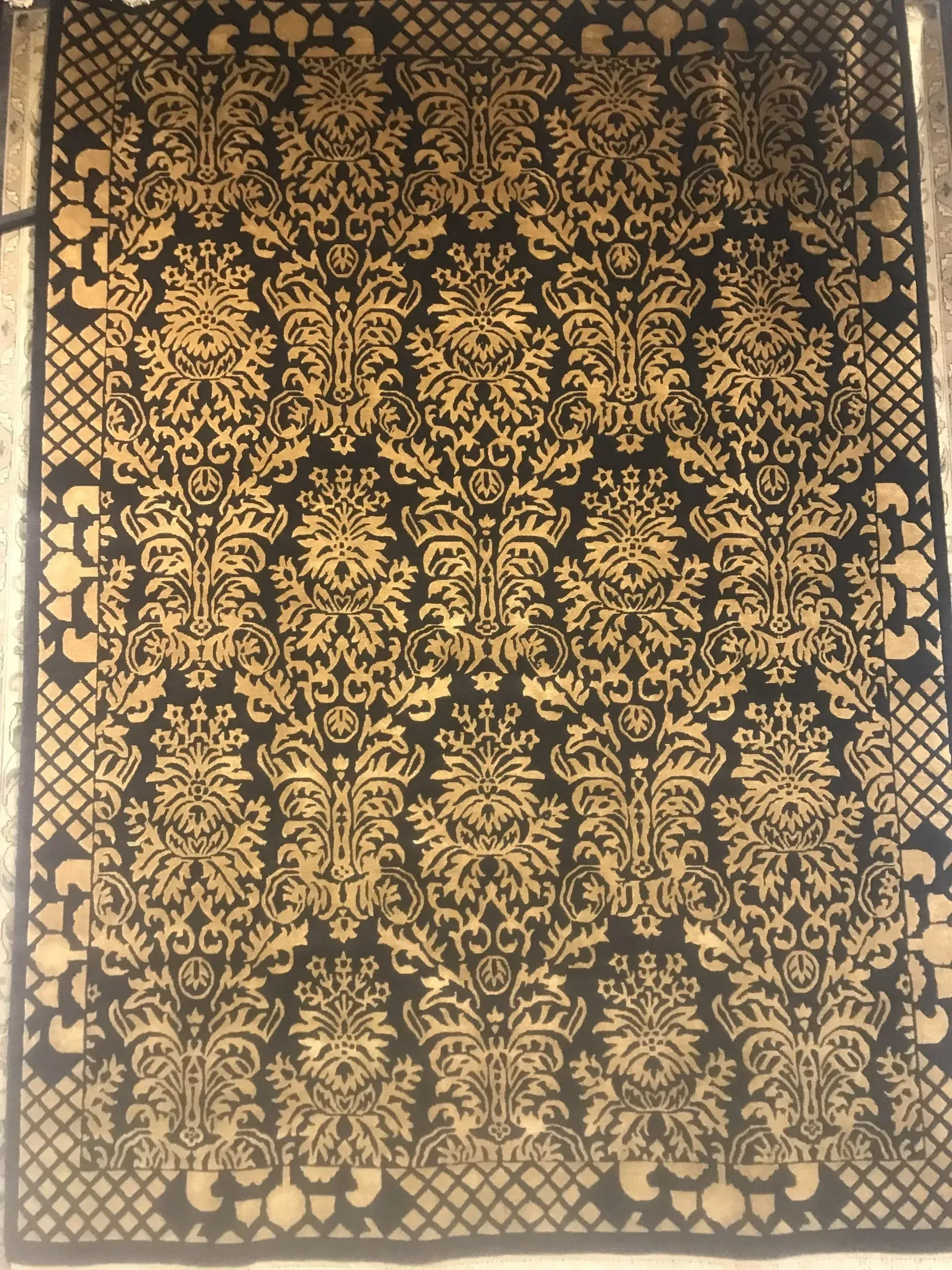 A rug with a detailed pattern on it.