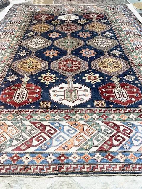 A rug with a detailed pattern on it.